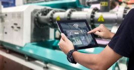 Electronic components worker using a tablet with motion tracking capabilities to keep track stock. Sourcengine carries Jorjin's component chip that can help with this and other Industrial Internet of Things.