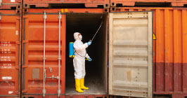 Inspector looking at cargo container before packing with electronic components; are you concerned about mitigating supply chain risk? Take a look at Sourcengine's e-commerce marketplace for help.