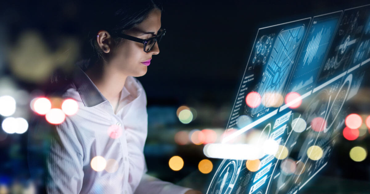 A procurement specialist looks at a data feed on screen. Learn more how the digitalization of the supply chain is an absolute necessity in the electronic components industry; here at Sourcengine.
