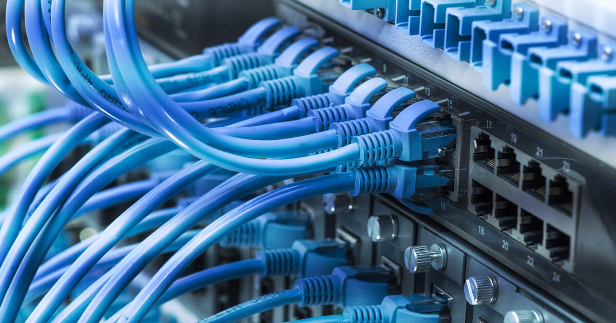 CAT cables running out of an industrial router. Teltonika's RUTX11 industrial router will help any supply chain manage its properties; find this product now at Sourcengine.