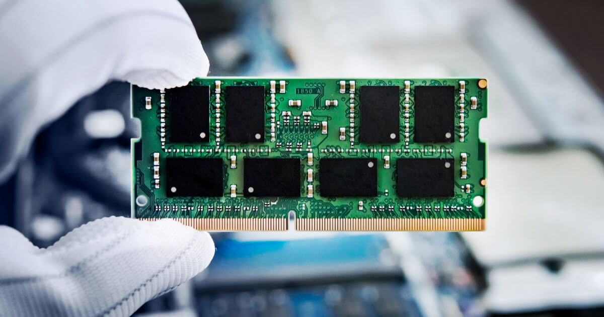 Memory chip in hands of engineer. For more on the latest DRAM and NAND chips, see data sheets, availabilities and pricing at Sourcengine.