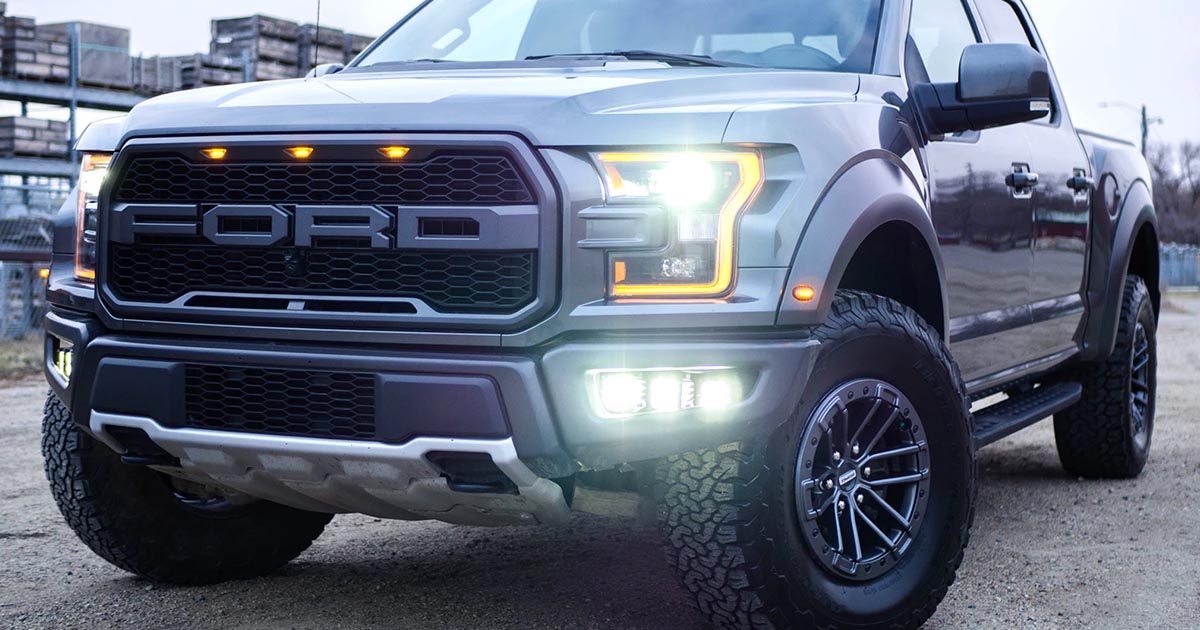 Ford truck on display; due to recent shortages in the component industry, Ford has been forced to temporarily halt production of its popular F-150. If you're dealing with shortages, check out Sourcengine where you can buy franchise-direct and from distributors.