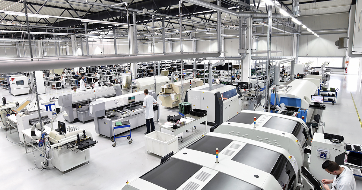 An overhead view of a fully staffed electronic components smart factory. | Sourcengine