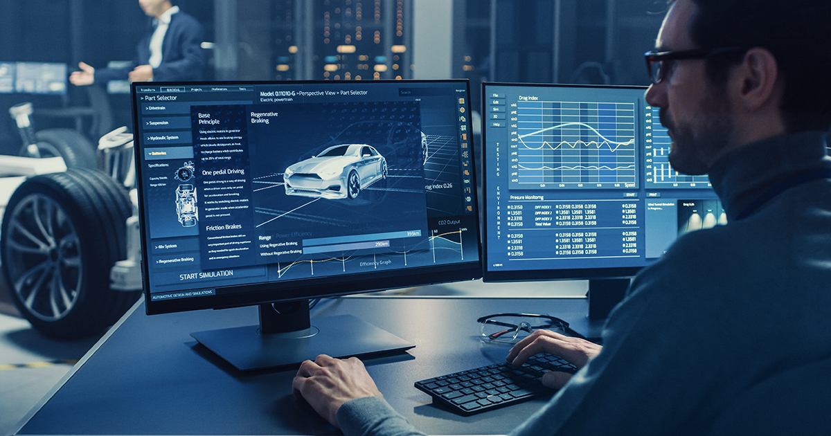 An engineer sits at a workstation designing an electric vehicle’s regenerative braking systems. | Sourcengine