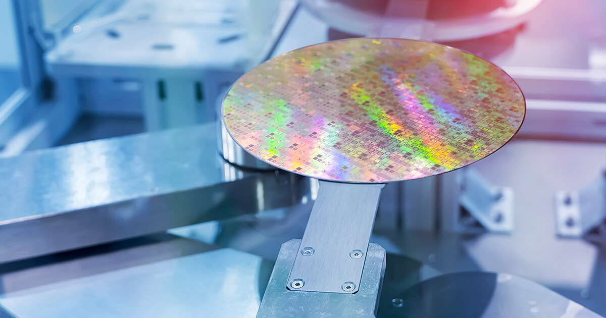 A silicon wafer sits on a piece of production equipment during the chipmaking process.