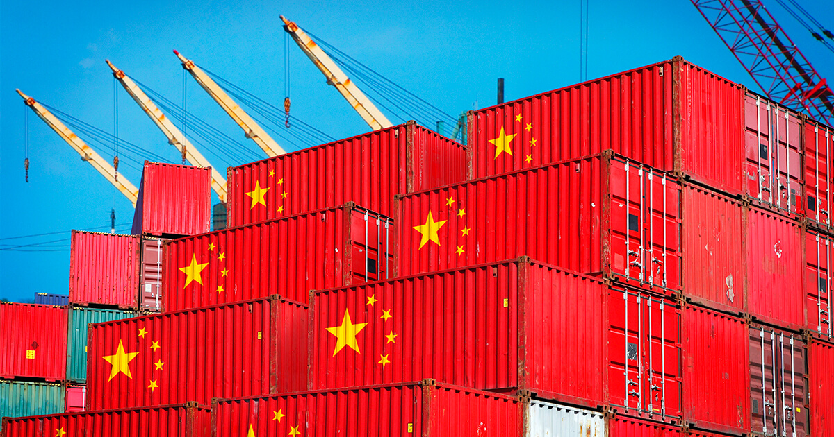 Two stack of shipping containers stamped with the details of the Chinese flags. 