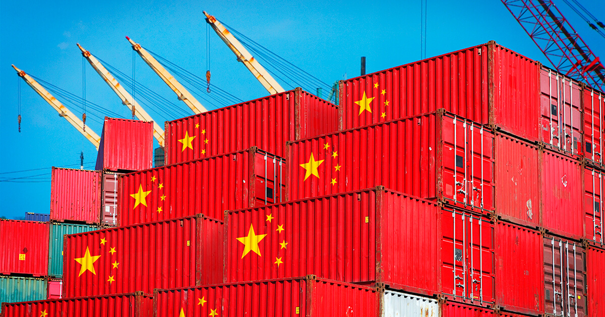 Two stack of shipping containers stamped with the details of the Chinese flags.