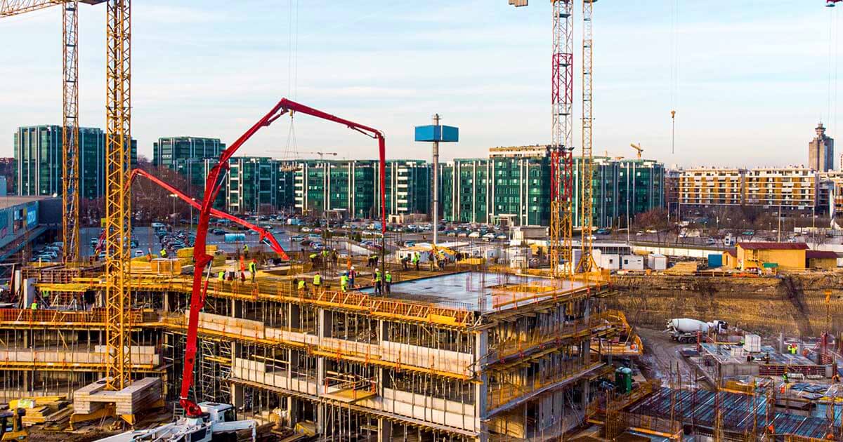 A photo of a massive active construction site in a modern city.