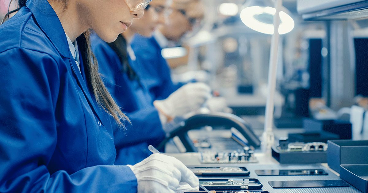 close-up of woman examining circuit board
