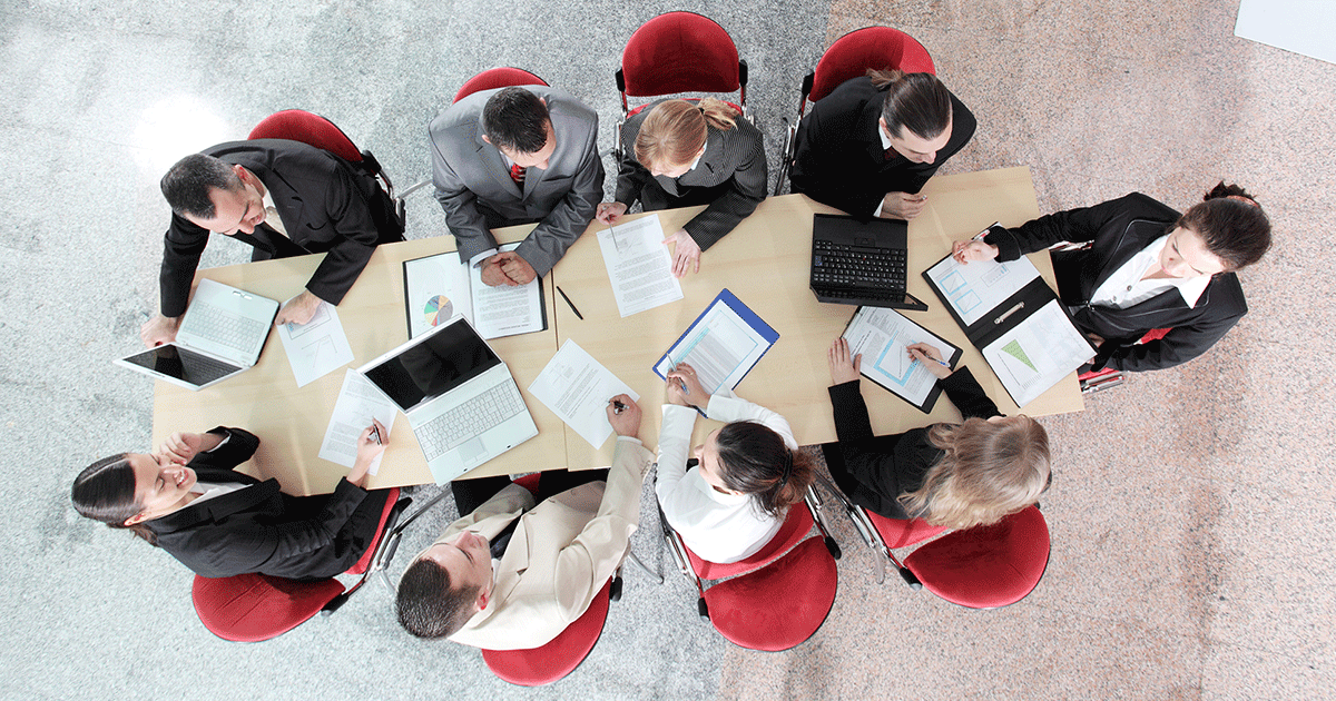 above view of businessmen and women having a meeting