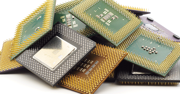 A stack of microchips, including several processors and memory components.