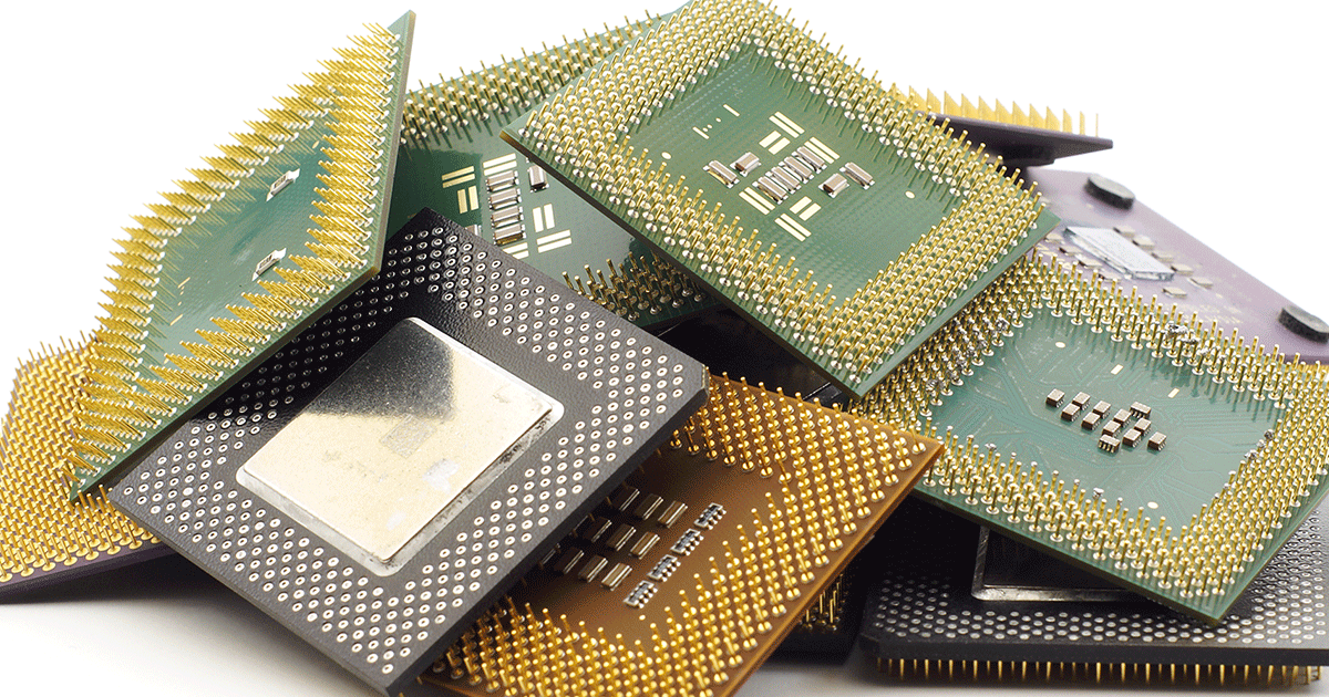 A stack of microchips, including several processors and memory components.