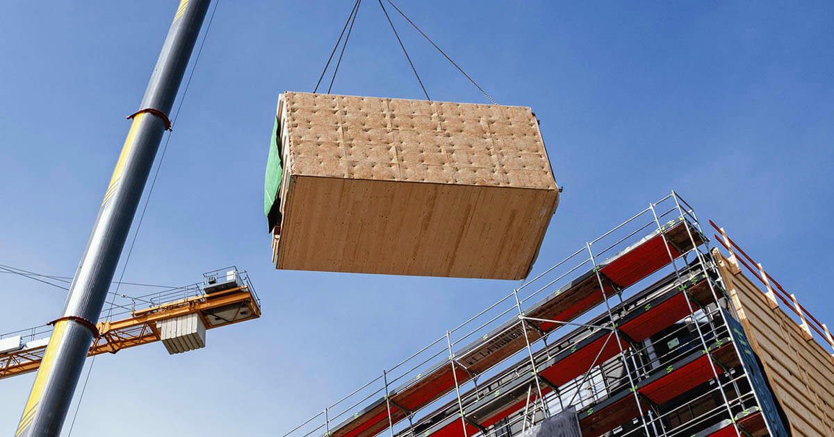A crane lifting construction materials