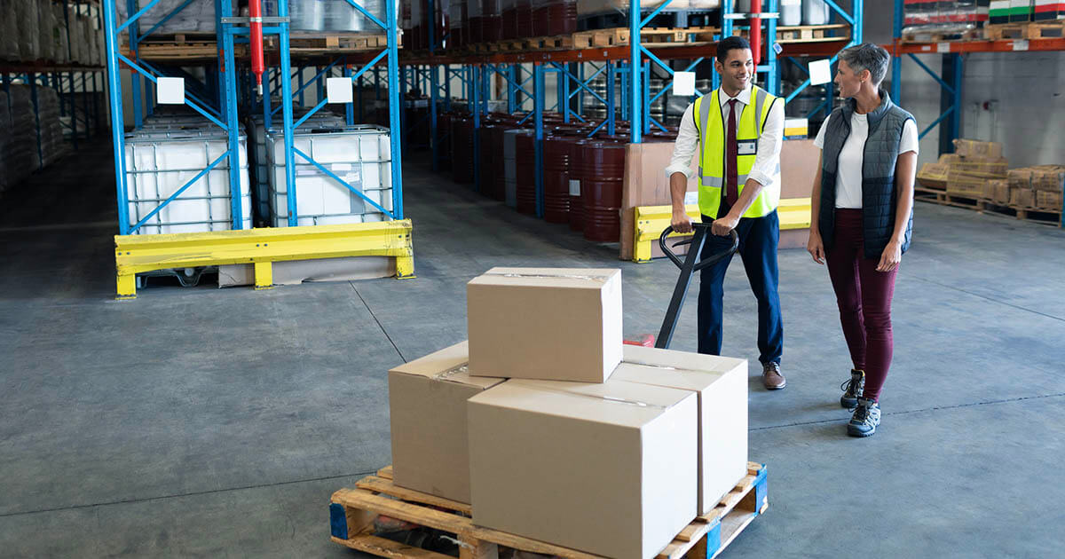 Warehouse staff transporting materials 