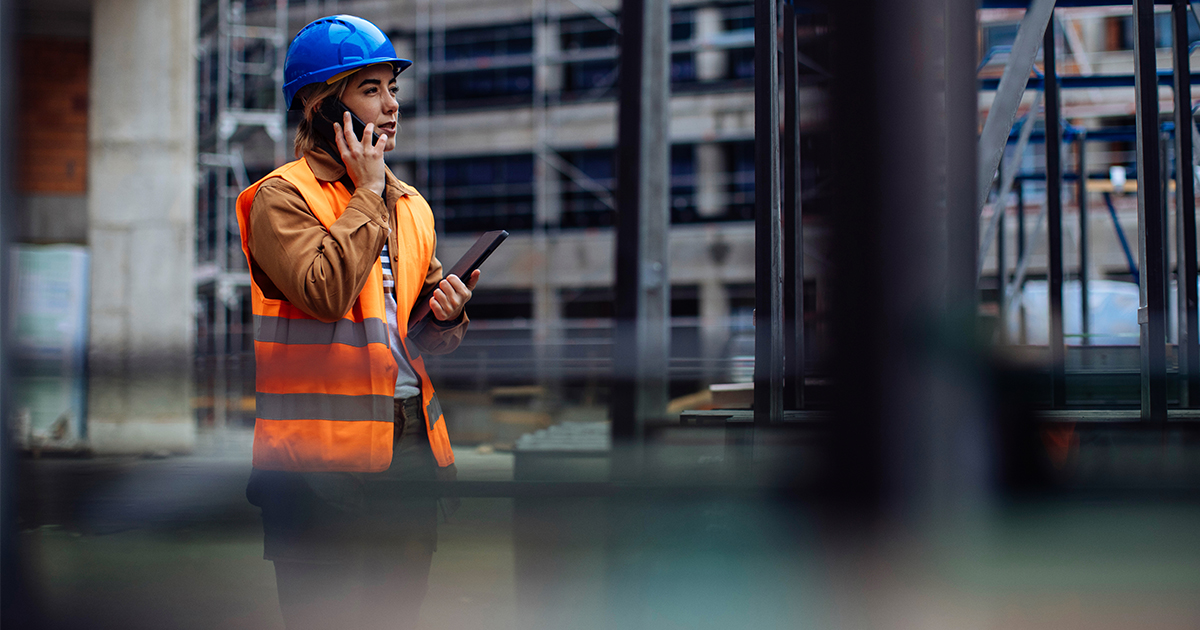 An engineer on the phone at a construction site