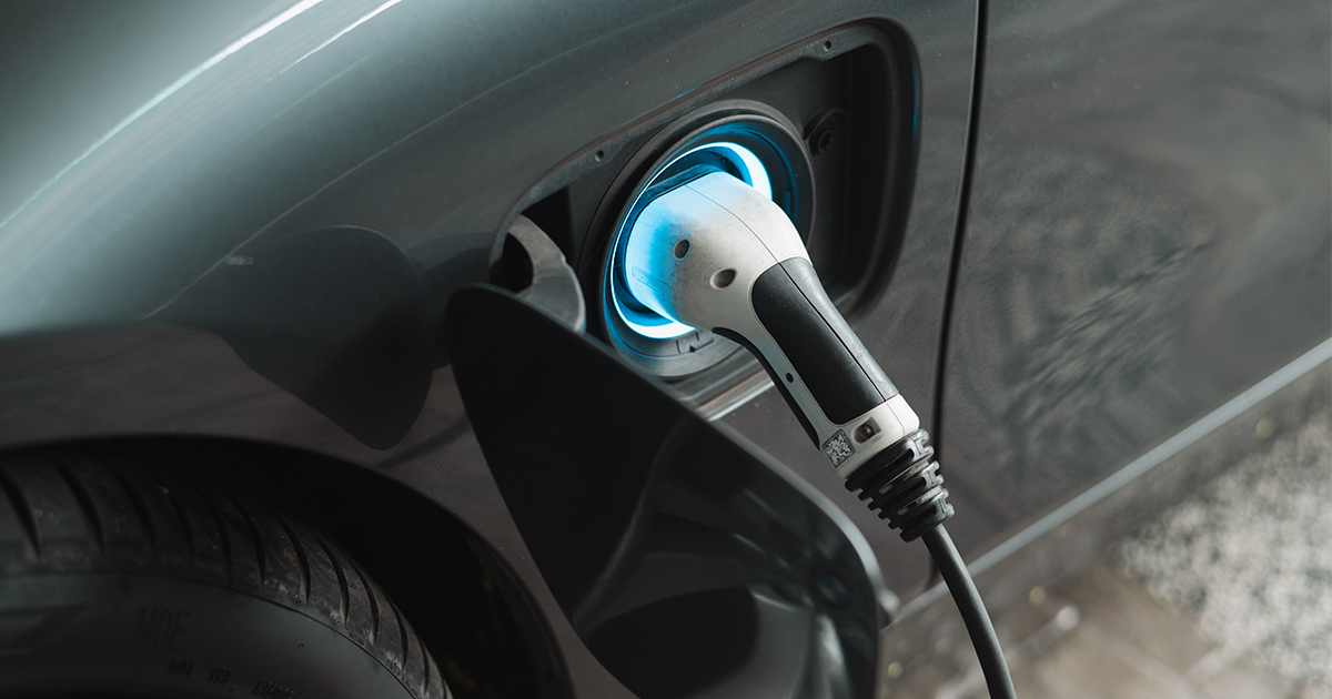 EV charger plugged into a car port