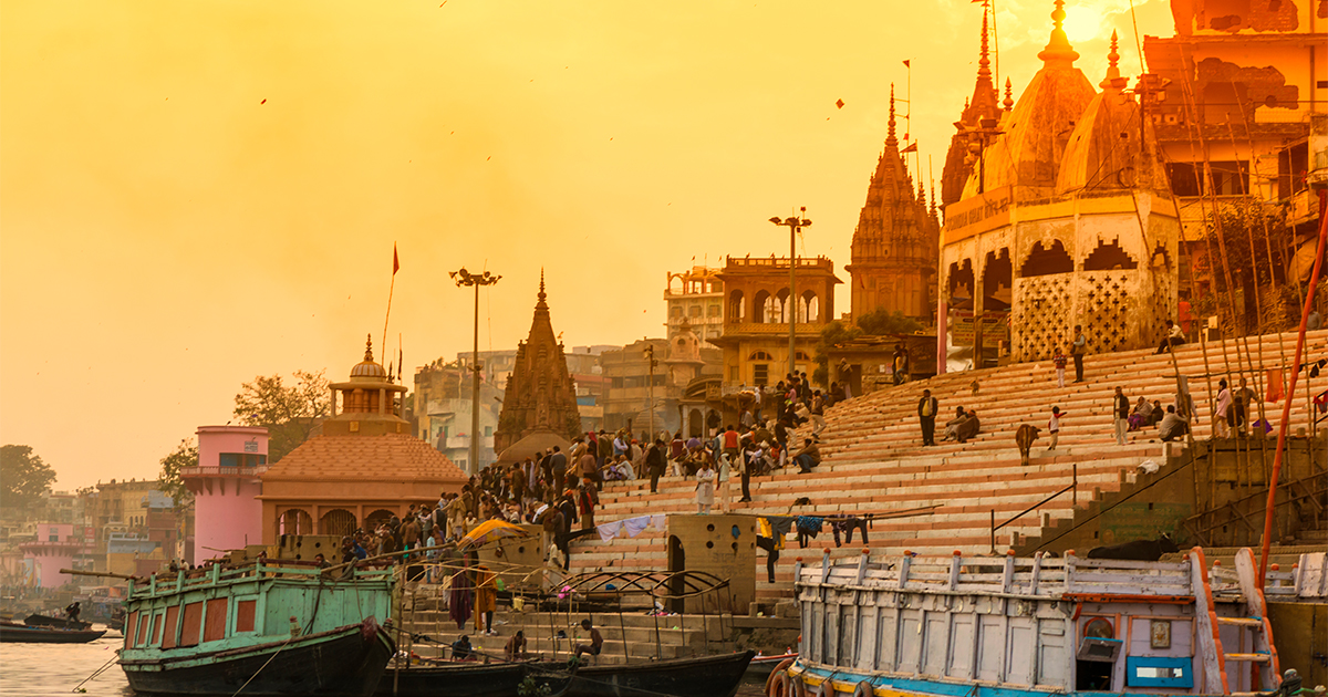 A picture of India at sunset on the river