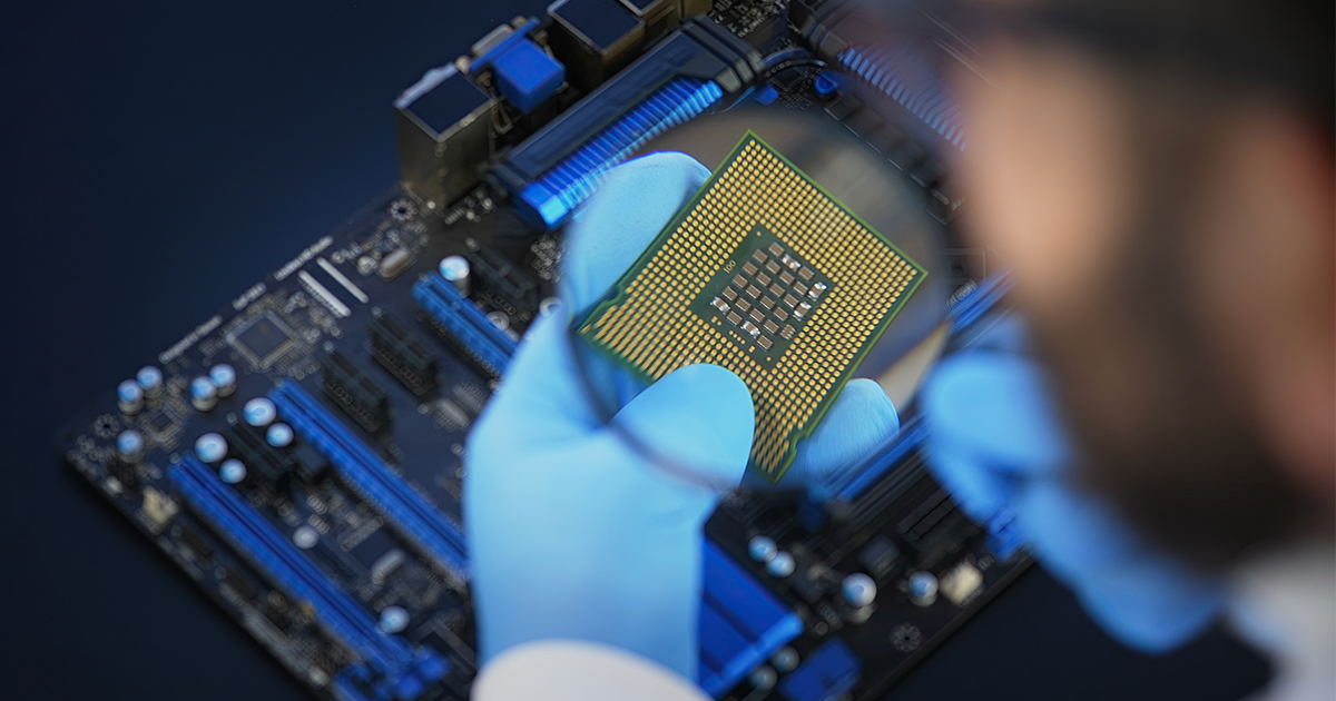 An image of a microchip under a magnifying glass