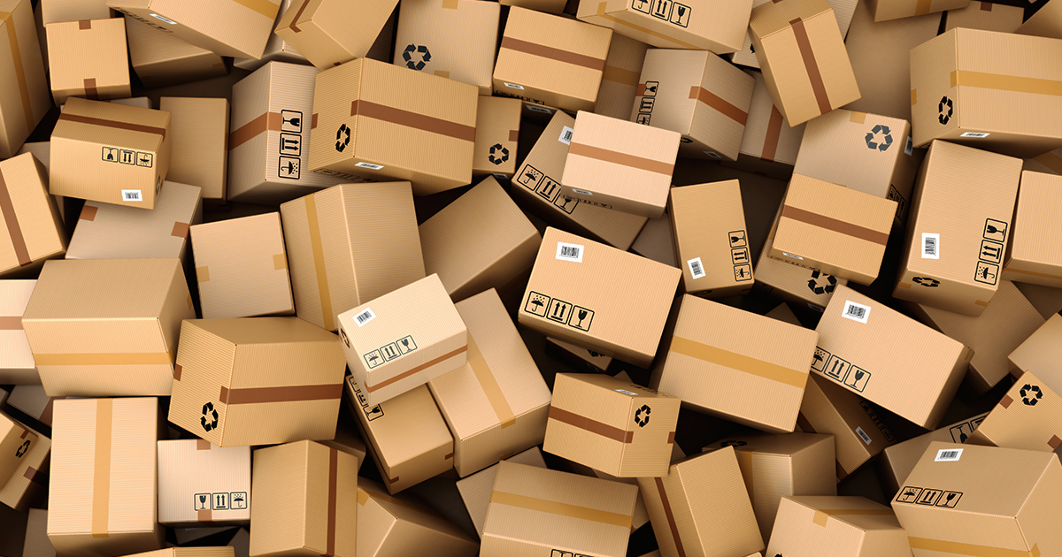 An image of dozens of boxes all lying in a pile on top of each other 