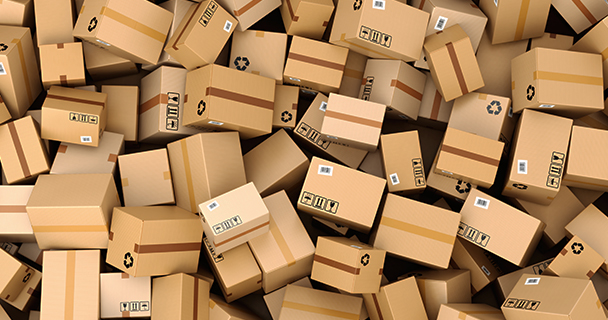An image of dozens of boxes all lying in a pile on top of each other 