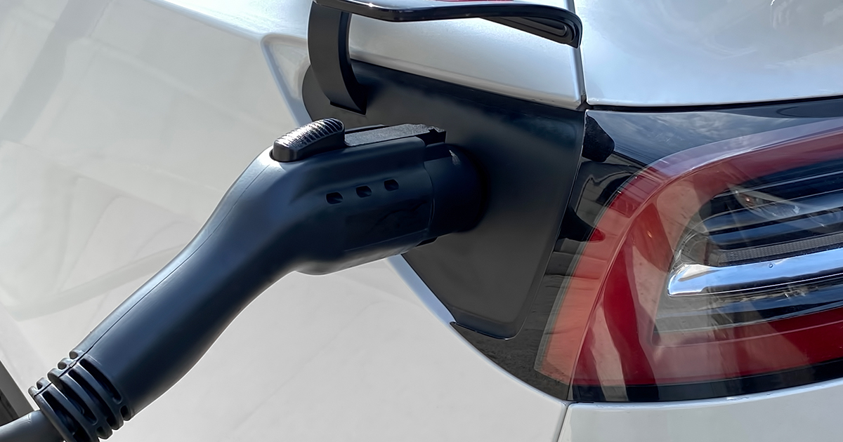 An image of an electric car charger in a car charge port