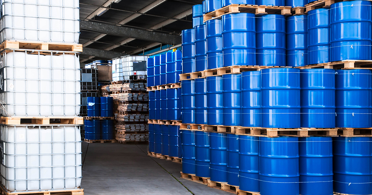 An image of blue chemical containers stacked up