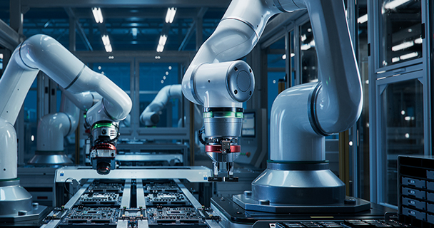 Image of robotic arms on a manufacturing production line