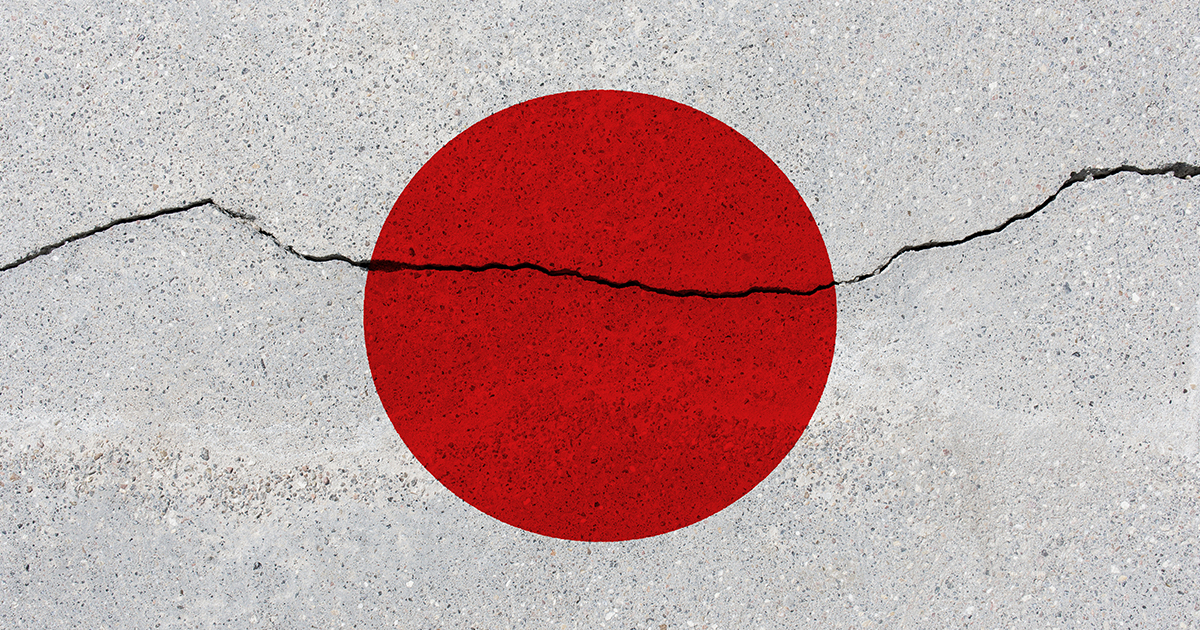 An image of the Japanese flag with a crack through it
